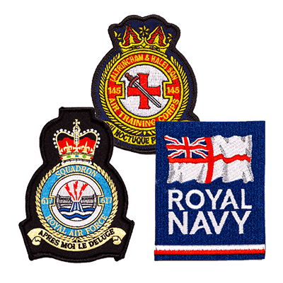 Assortment of detailed military badges> Navy Badge, MOD badges on display