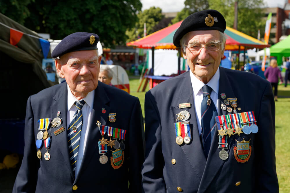 Two Army Men with their army medals <img decoding=